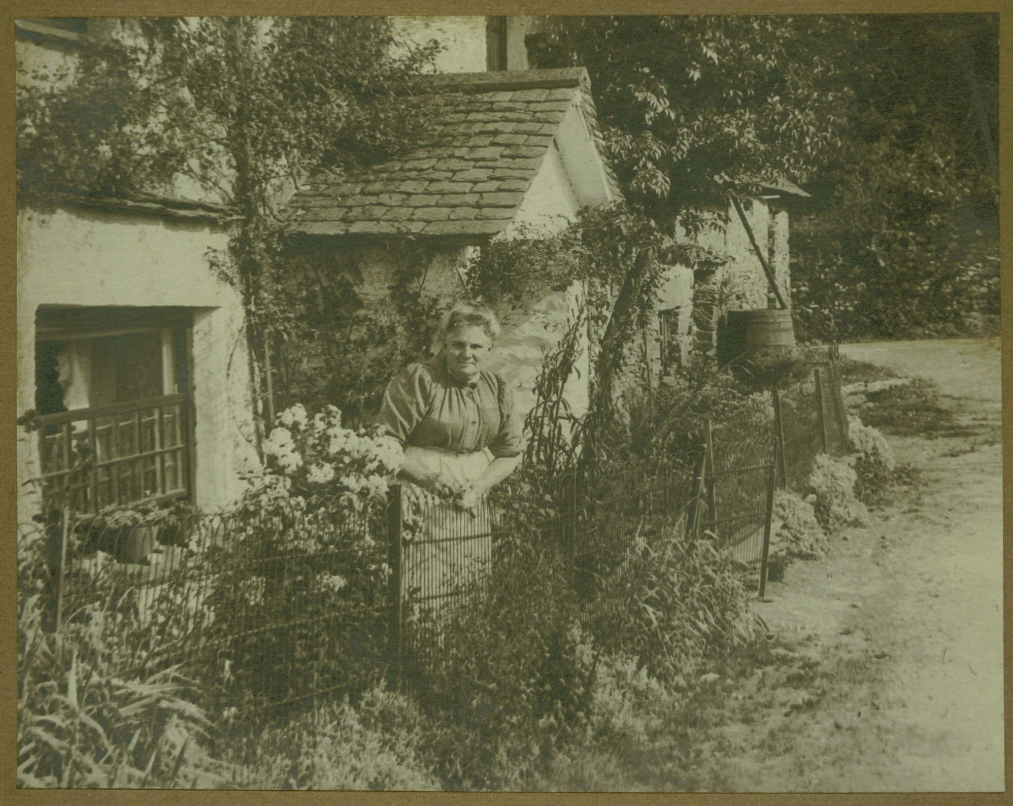 Anne Irwin outside Old Farm Cottage. The photo has the Year - 1914 written on the back